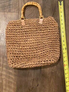 Bamboo handle weaved bag.